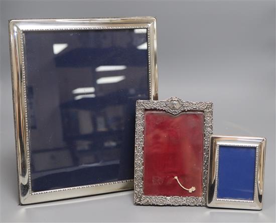 A late Victorian silver mounted photograph frame, Chester, 1896 and two modern silver frames, largest 29.3cm.